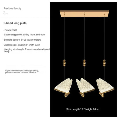 Modern gold butterfly pendant lamps featuring gold-toned three-head pendant lamps with textured triangular glass shades