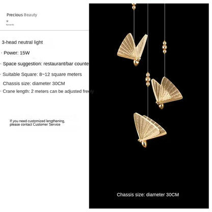 Gold-colored decorbites butterfly pendant lights with intricate detailing suspended by thin wires for luxury bedroom decor