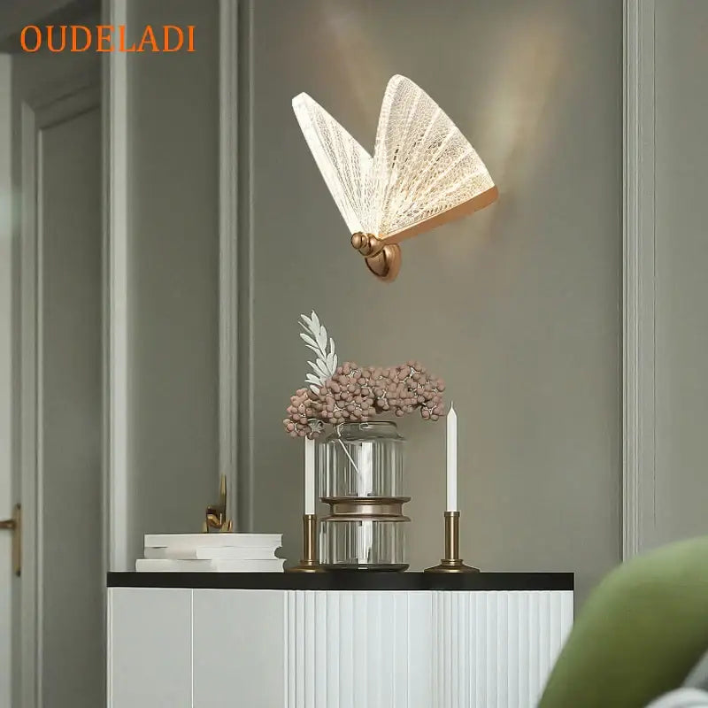 Modern gold butterfly wall lamp with delicate translucent lace detailing and golden base for elegant bedroom decorbites wall lamp