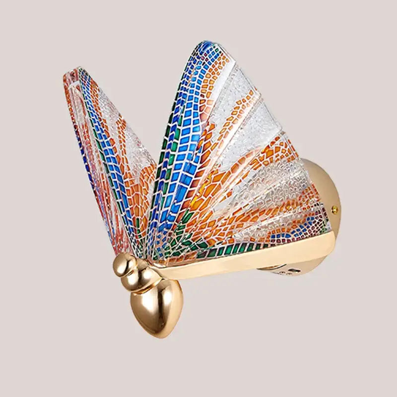 Modern gold butterfly wall lamp with vibrant blue orange and green mosaic wings in a decorative bedroom wall lamp design