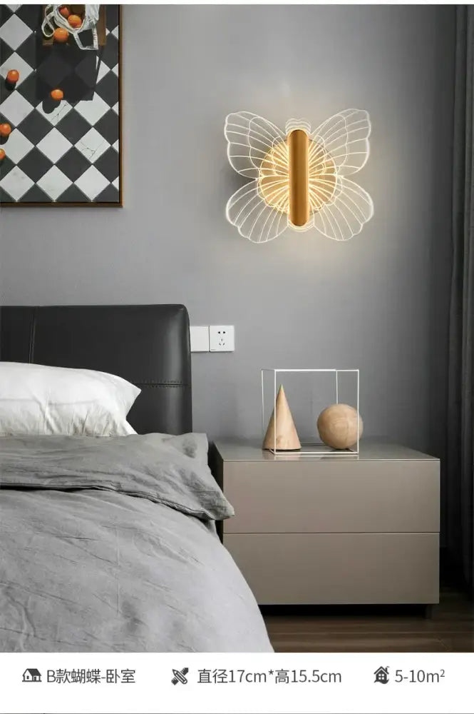 Modern gold butterfly wall lamp with delicate white wireframe wings and warm led light perfect for bedroom decorbites wall lamp