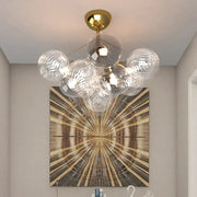 Modern gold cartoon bubble ball chandelier with clear textured glass spheres for kids room decorbites cartoon bubble design