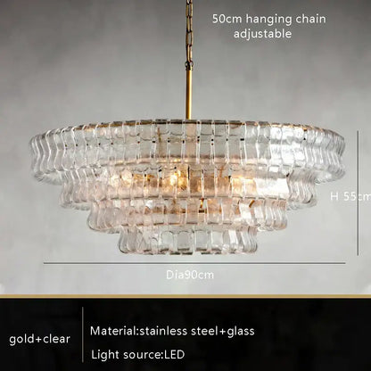 Modern gold cascading crystal pendant lights featuring a tiered clear glass chandelier with gold stainless steel frame