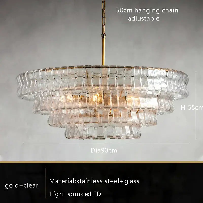 Modern gold cascading crystal pendant lights featuring a tiered clear glass chandelier with gold stainless steel frame
