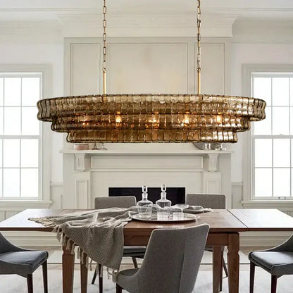 Modern gold cascading crystal pendant lights with gold-toned double-tiered brass chain and brown glass panels decorbites brown glass