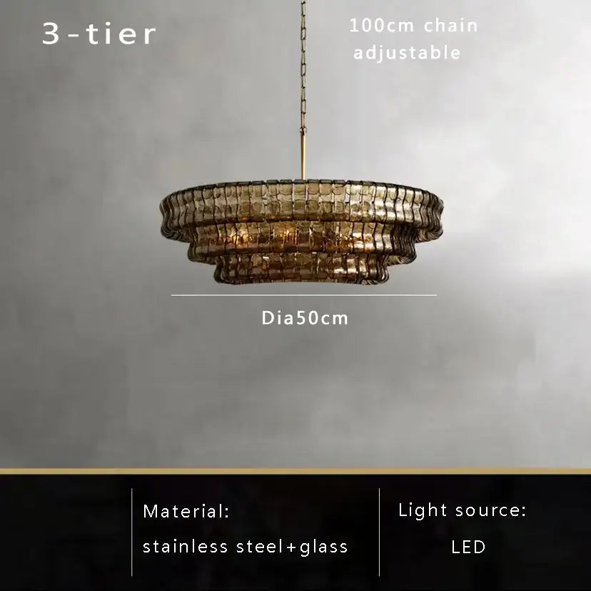 Modern gold cascading crystal pendant lights featuring a three-tiered brown glass pendant with stainless steel frame