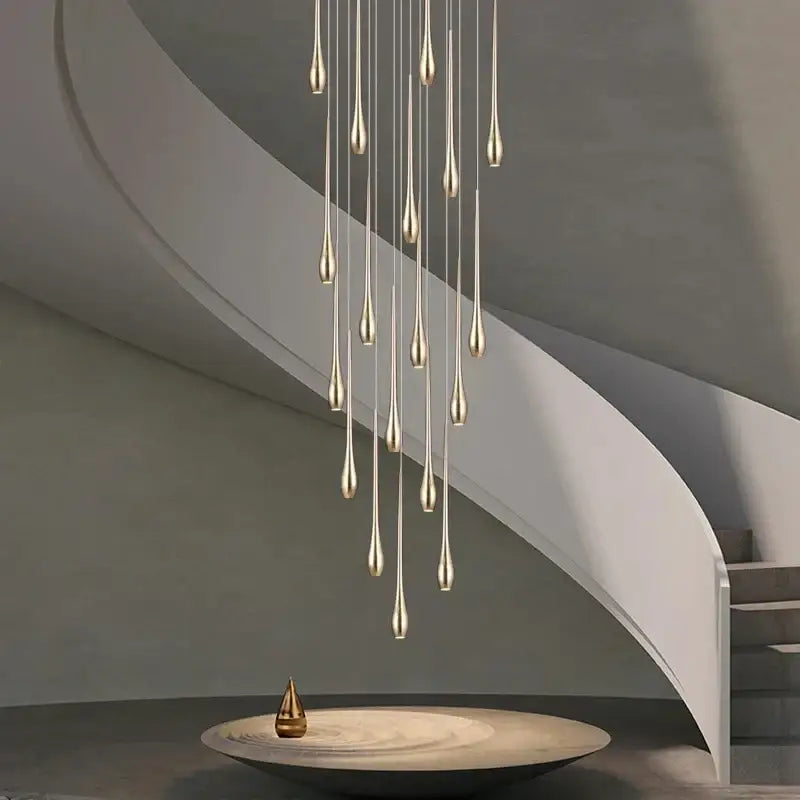 Modern gold-toned led ceiling chandelier with slender teardrop lights in a cascading arrangement for living room