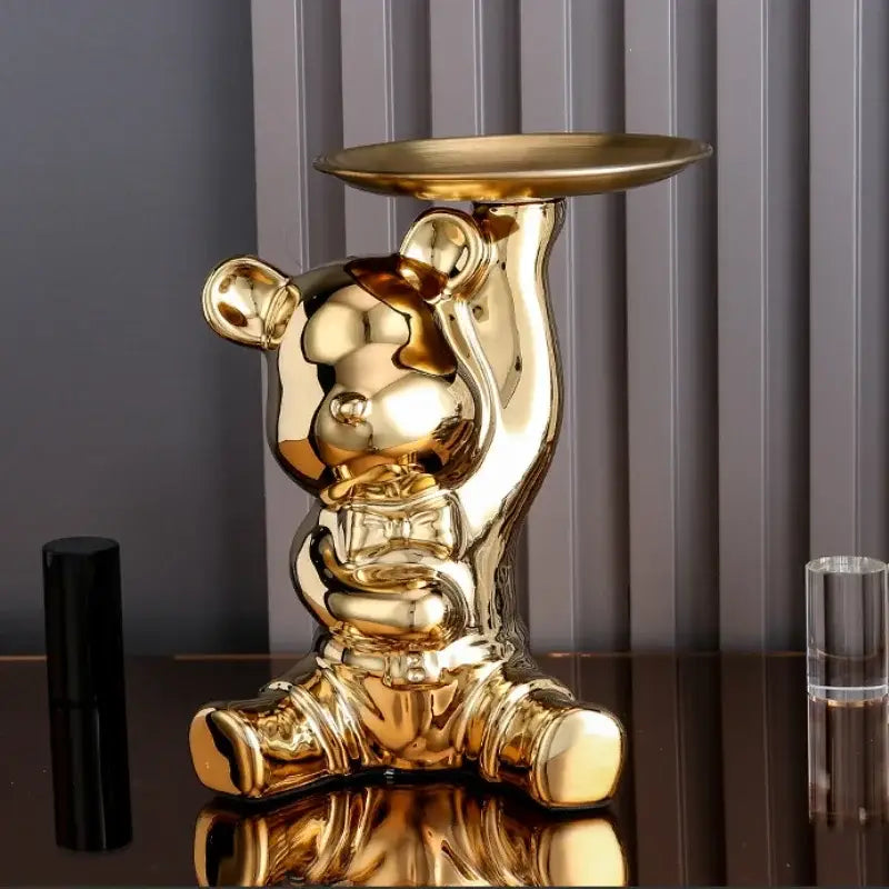Modern gold ceramic electroplating bear tray with glossy metallic finish and raised arms holding an oval tray for decoration