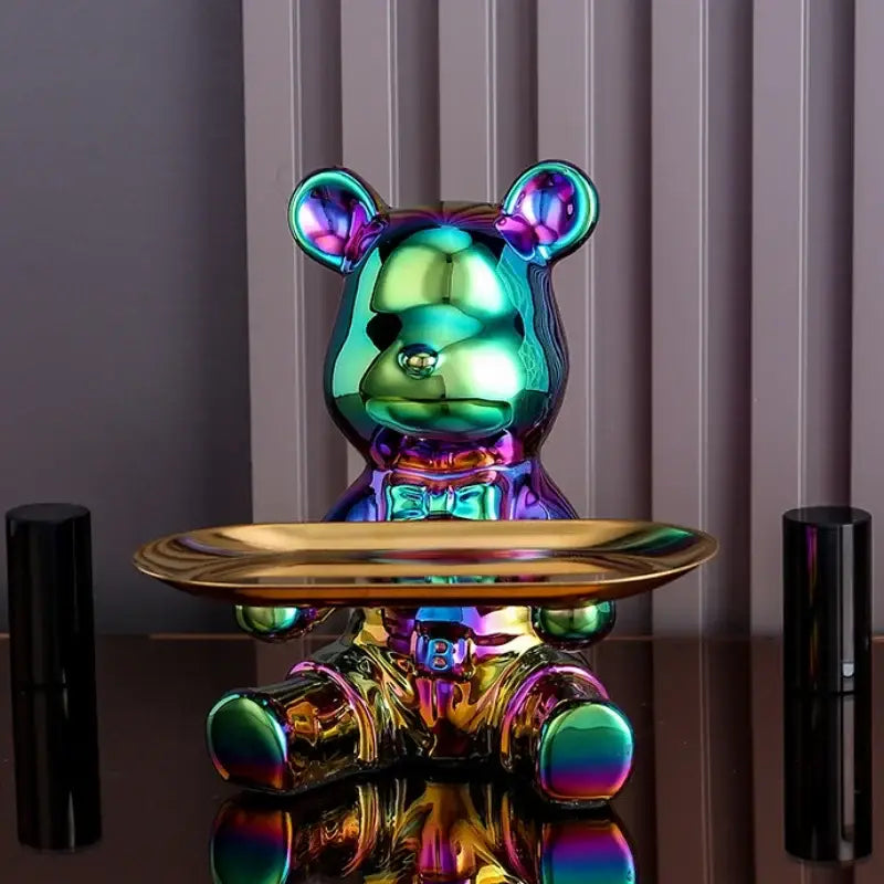 Modern gold ceramic electroplating bear ornament with iridescent glossy metallic finish and vibrant rainbow hues on tray