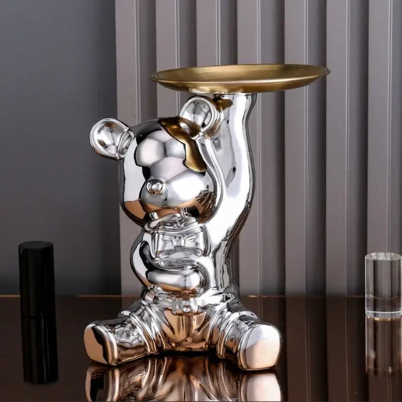 Shiny silver ceramic electroplating bear figurine holding a gold tray for modern living room decoration
