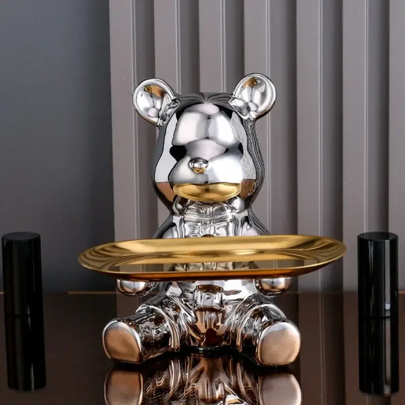 Shiny silver ceramic electroplating bear figurine holding a gold-trimmed tray for living room decoration