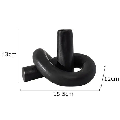 Black ceramic candle holder with sleek knot design as modern decorbites ceramic knot sculpture for living room decorbites ceramic