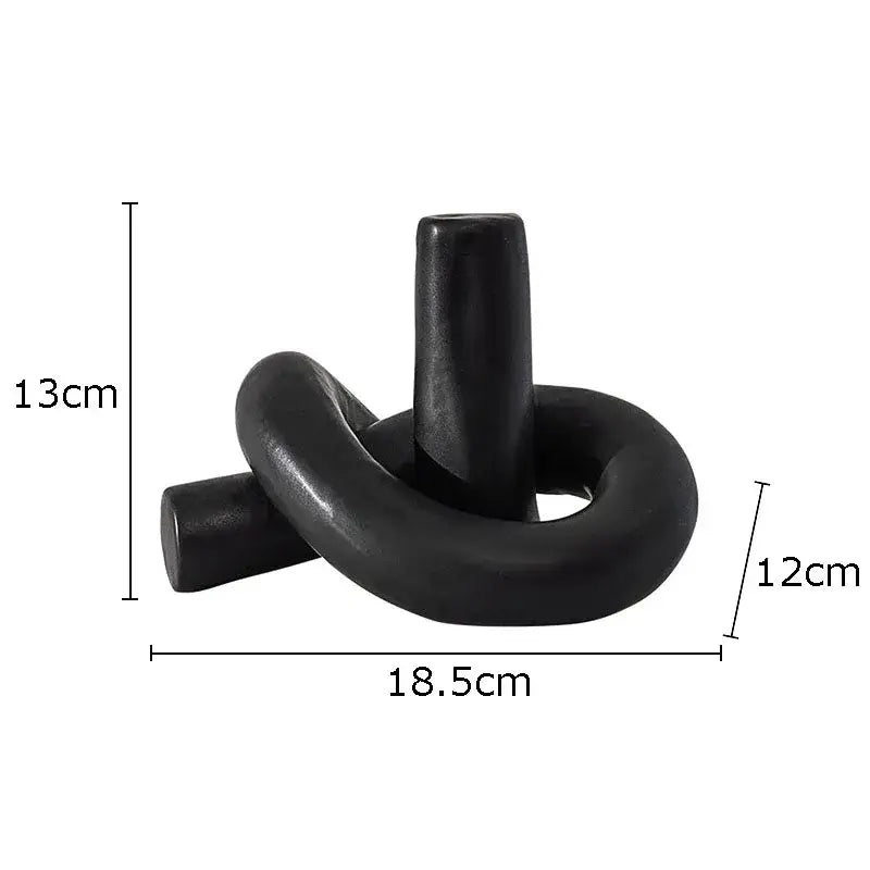 Black ceramic candle holder with sleek knot design as modern decorbites ceramic knot sculpture for living room decorbites ceramic