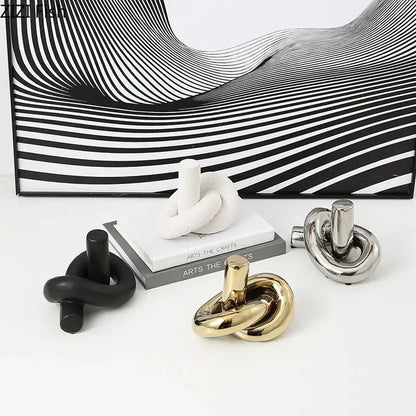 Modern gold ceramic knot sculpture by decorbites featuring a sleek minimalist polished gold finish for living room decor