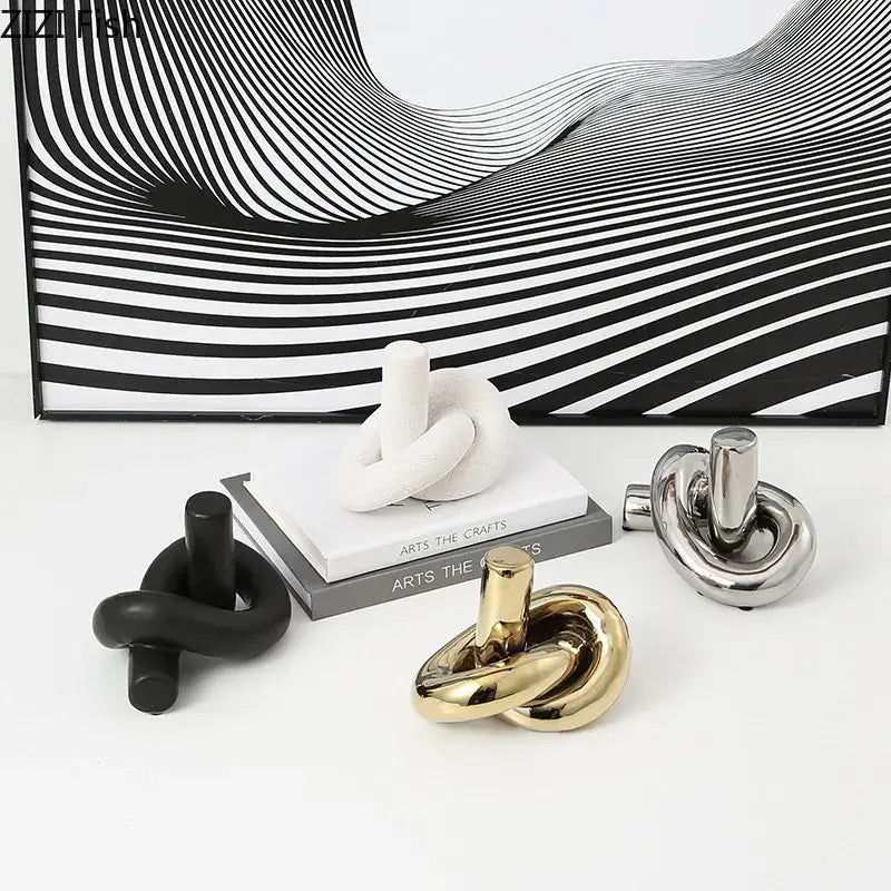 Modern gold ceramic knot sculpture by decorbites featuring a sleek minimalist polished gold finish for living room decor