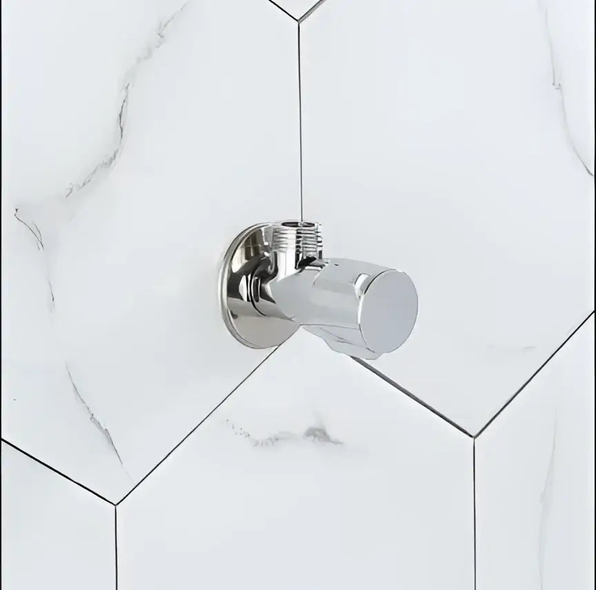 Modern gold and chrome brass triangle valve bathroom water control with chrome finish on marble patterned hex tiles decorbites brass triangle