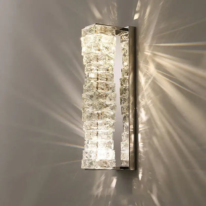 Modern gold and chrome crystal wall lamp with stacked clear blocks emitting geometric light shadows for decorbites crystal wall decor
