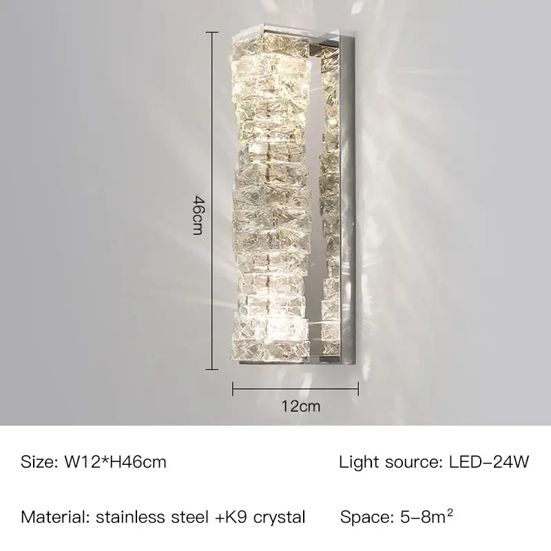 Modern gold and chrome crystal wall lamp with stainless steel frame and cascading k9 crystals emitting warm light