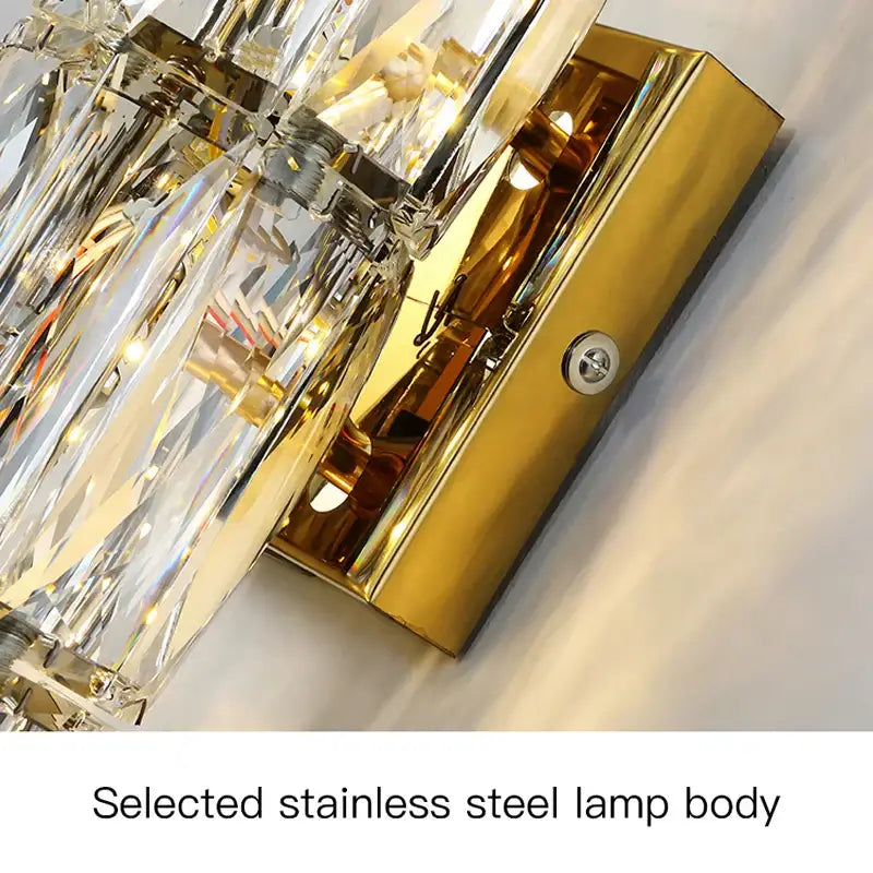 Gold finished stainless steel wall lamp with faceted crystal prisms modern decorbites crystal wall sconce
