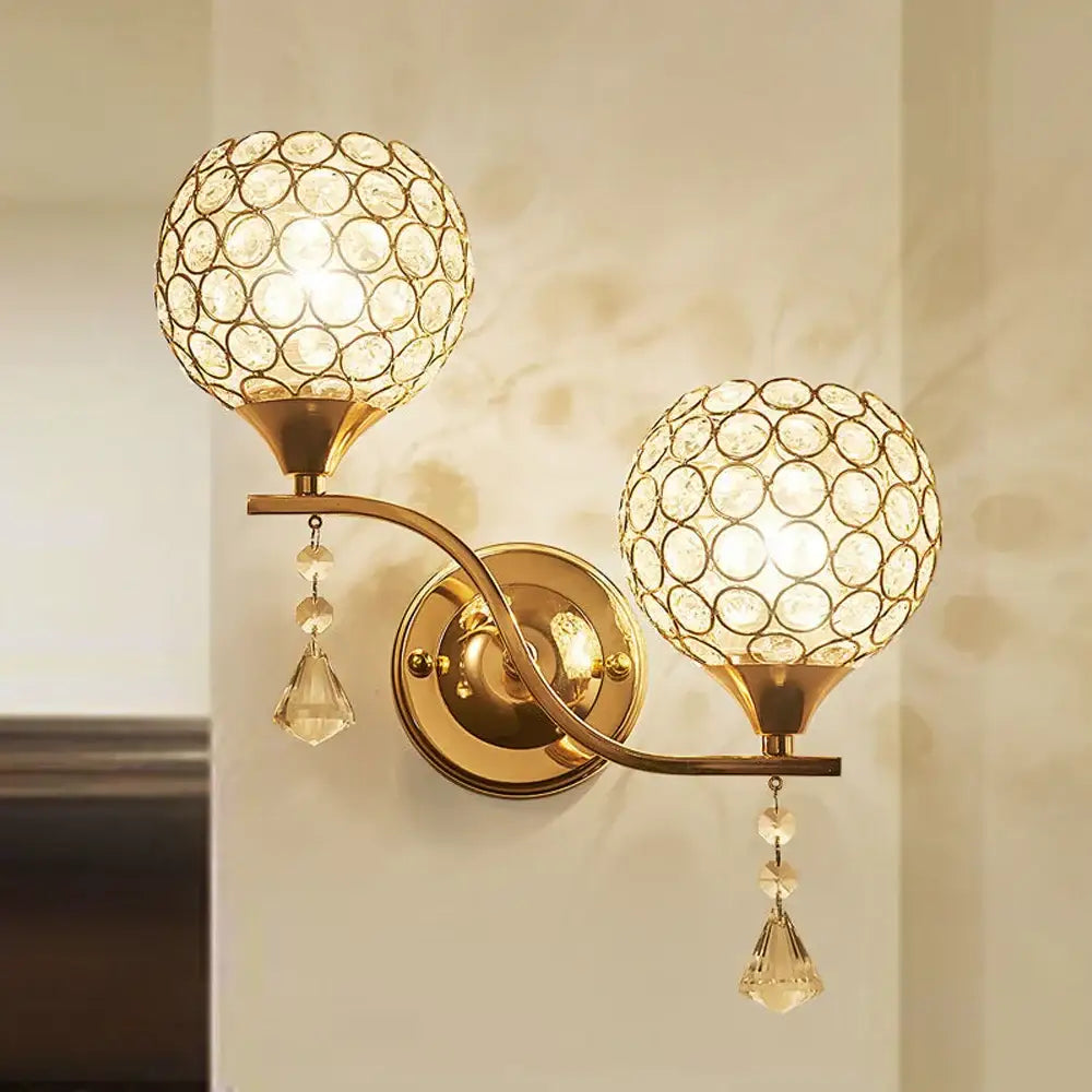 Modern gold wall sconce with two crystal globe shades and faceted pendants for decorbites crystal wall lighting