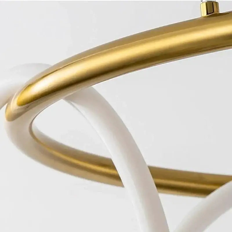 Modern gold circle note linear light bedroom pendant lamp with sleek interlocking gold and white curved metal rings decorbites circle note