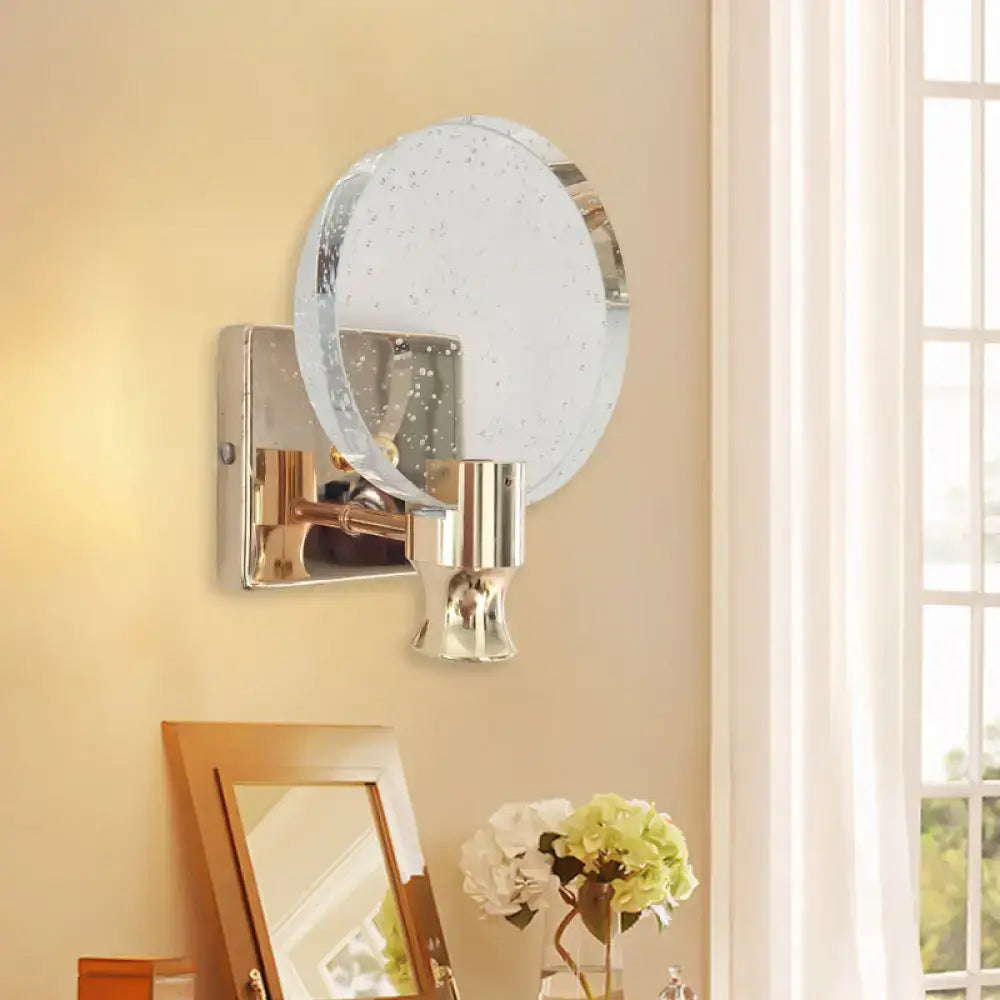 Modern gold circle panel wall light with circular translucent glass shade and polished chrome accents for direct wired electric use