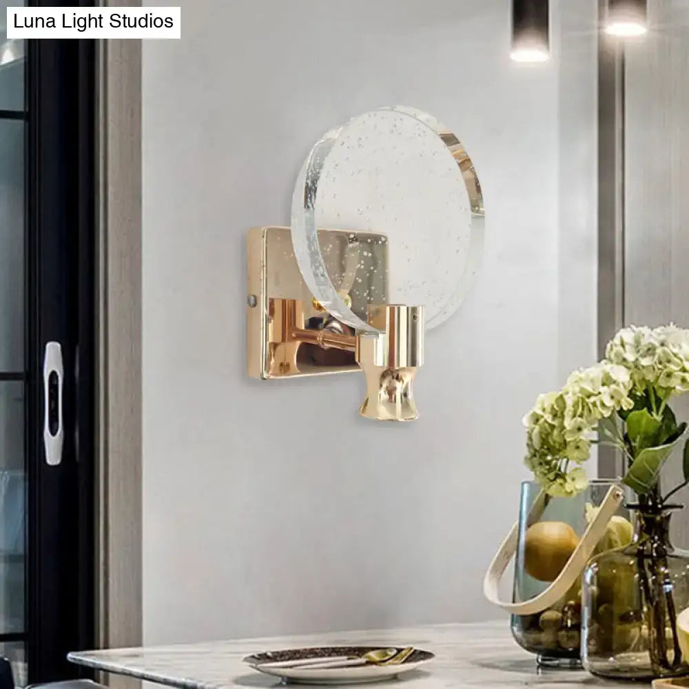 Modern gold circle panel wall light with direct wired electric and speckled translucent glass shade for bedroom use