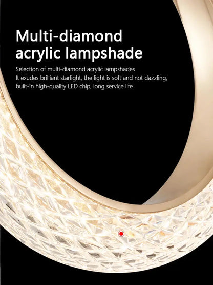 Modern gold circle ring led chandelier with a curved acrylic lampshade featuring a multi-diamond pattern for starlight diffusion