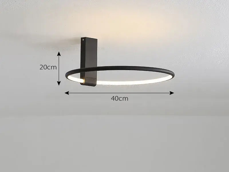 Modern black circular led wall sconce with illuminated ring complements decorbites circular led ceiling light for bedroom decor