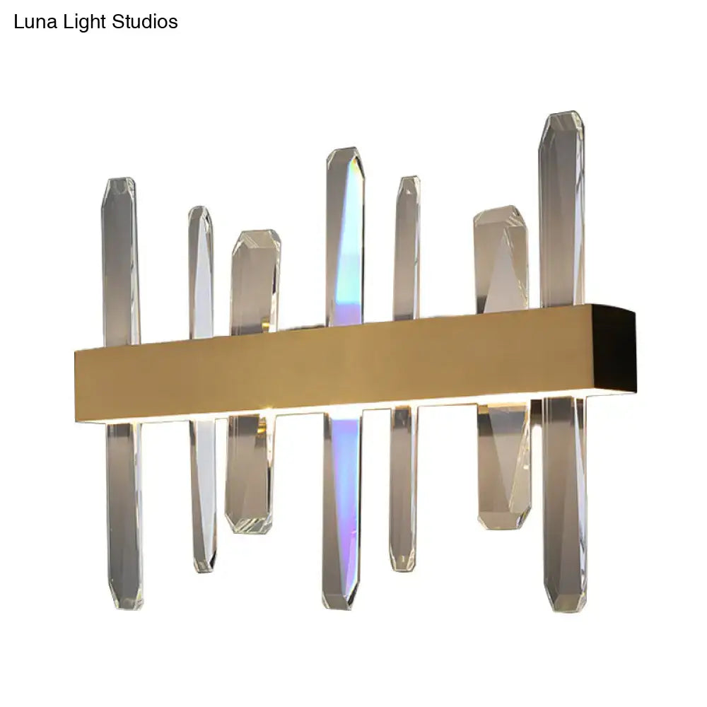 Modern gold clear crystal bar wall sconce with sleek rectangular base and vertical clear crystal prisms for bedroom light