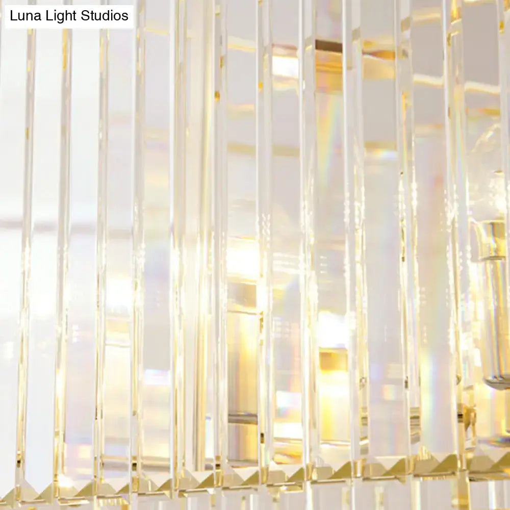 Modern gold clear crystal island chandelier with vertical transparent rods and gold accents for dining room lighting