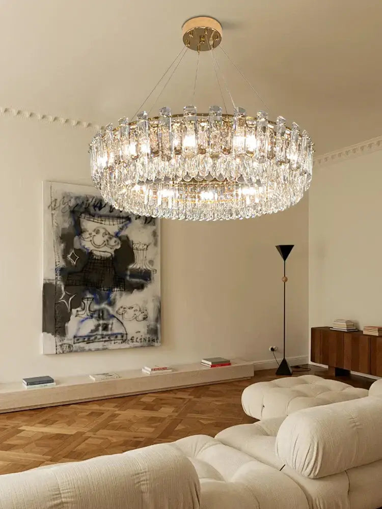 Modern gold clear crystal oval chandelier dining room light with tiers of faceted crystals and gold-toned frame decorbites clear crystal