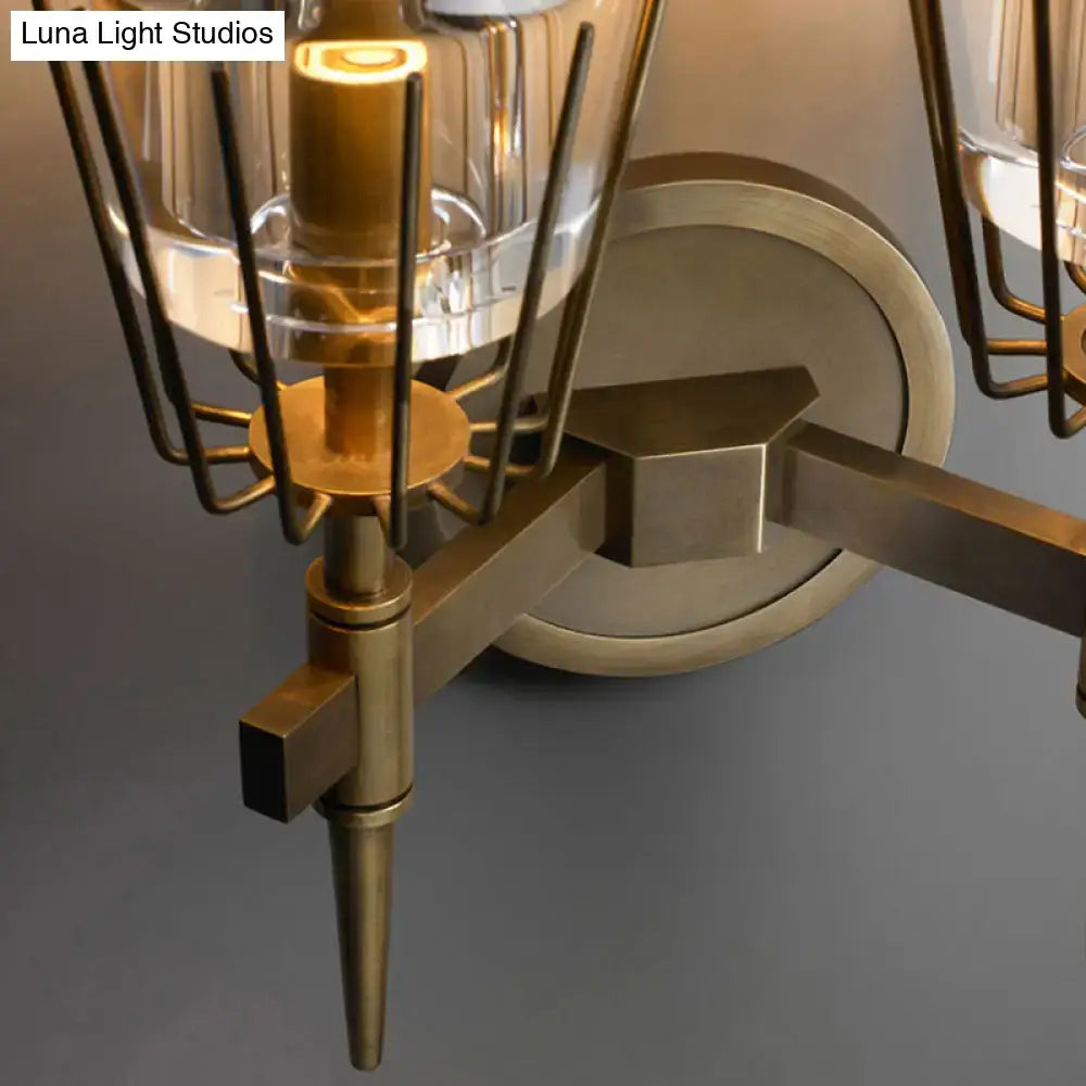 Brass-finished modern wall lamp with clear glass shades and geometric metal cage for bedroom 110v-120v 220v-240v use
