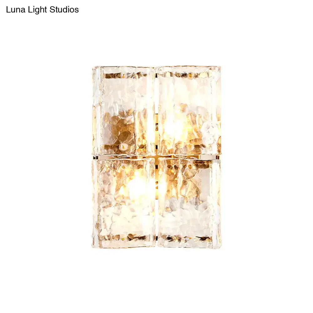 Modern gold clear water glass wall sconce with textured water glass shade designed for bedroom lighting with 2 lights