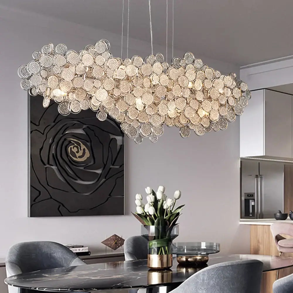 Modern gold cloud led ceiling chandelier featuring textured circular glass discs in an oval shape for living room use