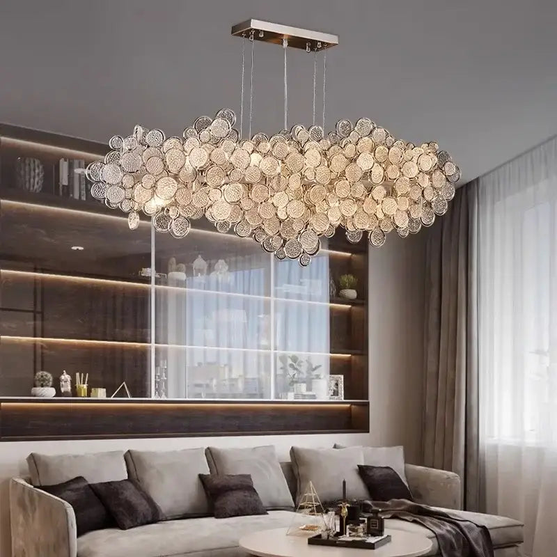 A modern gold cloud led ceiling chandelier with circular glass discs on a sleek metallic frame for living room
