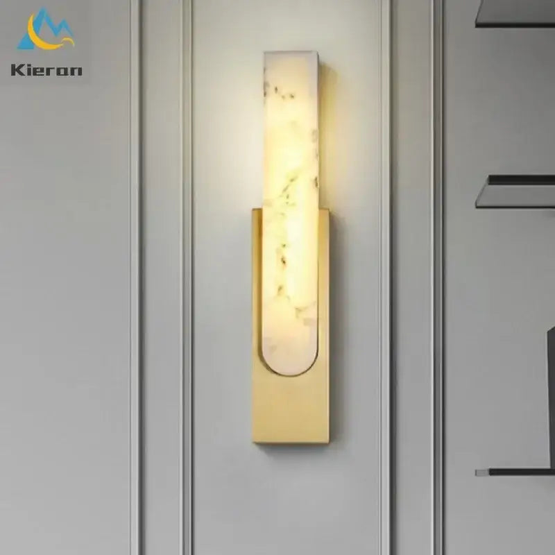 Modern gold cloud stone led wall light featuring a gold-toned rectangular marble-like panel emitting warm light