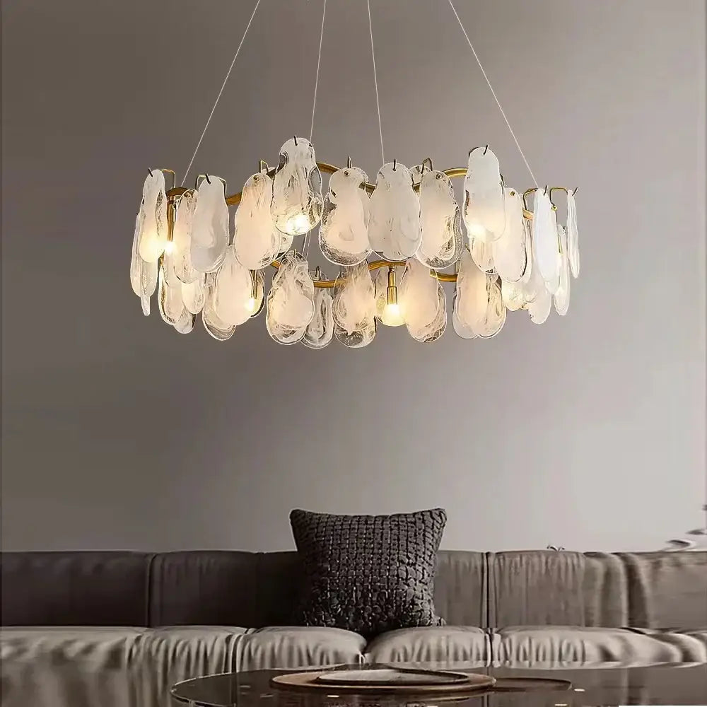 A modern gold cloudy glass chandelier with translucent shell-like shades and brass frame for living room lighting decorbites cloudy glass