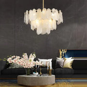 A modern gold cloudy glass chandelier with translucent layered glass shells for living room lighting decorbites cloudy glass