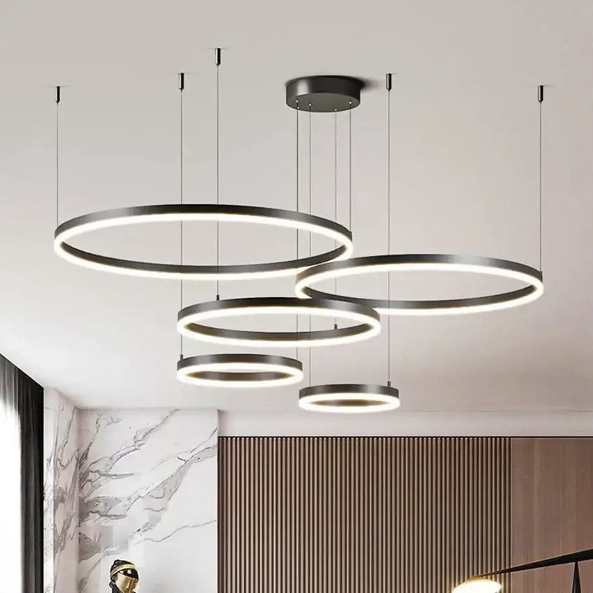 Modern black circular led pendant chandelier with glowing white brushed rings for dining room lighting