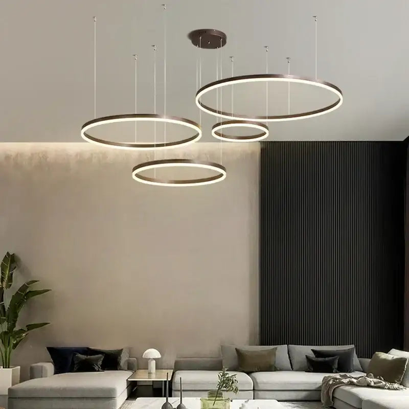 Modern gold and coffee brushed rings pendant chandelier with sleek circular rings and warm white pendant light glow