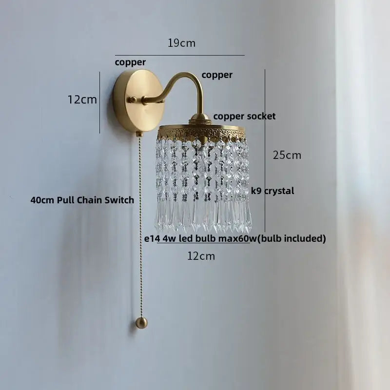 Modern gold conch shell wall light fixture with brass-finished copper and cascading clear k9 crystal prisms
