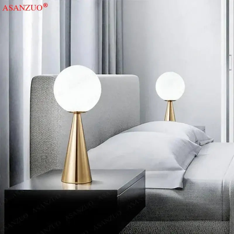 Modern gold-toned cone glass table lamp featuring a smooth white frosted globe ideal for bedroom decorbites cone glass lighting