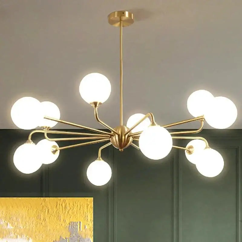 Modern gold copper ceiling chandelier featuring multiple frosted glass globes in a branching decorbites copper design