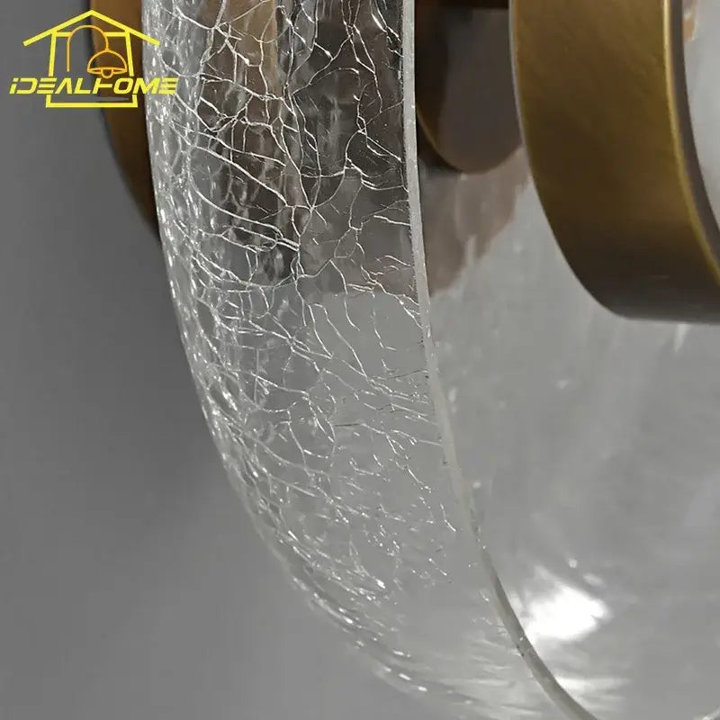 Modern gold cracked glass wall lamp with amber cracked glass shade and brass mounting hardware for bedroom decorbites cracked glass