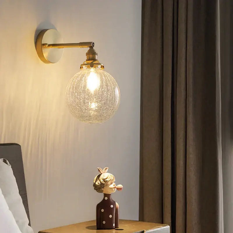 Gold-toned modern led wall lights with crackled glass globe shade for bedroom decorbites led wall lighting