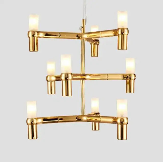 Modern gold decorbites crown major chandelier with tiered bamboo design and frosted glass candle bulbs for foyer lighting