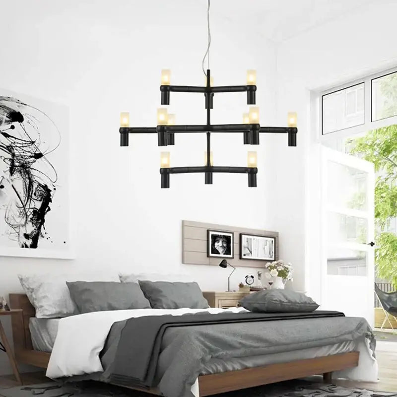 Modern gold crown major chandelier with black industrial-style cylindrical light fixtures in a geometric cross pattern decorbites crown major