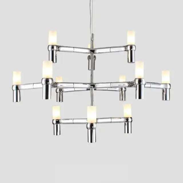 Modern gold crown major chandelier with chrome finish bamboo-inspired design and warm glowing cylindrical bulbs decorbites crown major