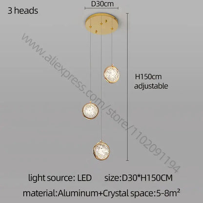 Modern gold crystal ball chandelier featuring three gold-toned crystal ball shades suspended from aluminum mount